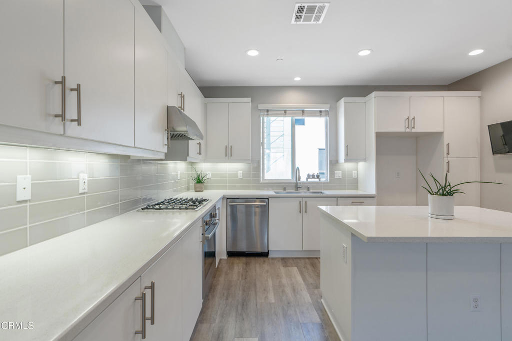 1553 Verbena Way Los Angeles, CA 90041 - Photo 14 of 31 a kitchen with a sink cabinets stainless steel appliances and a window