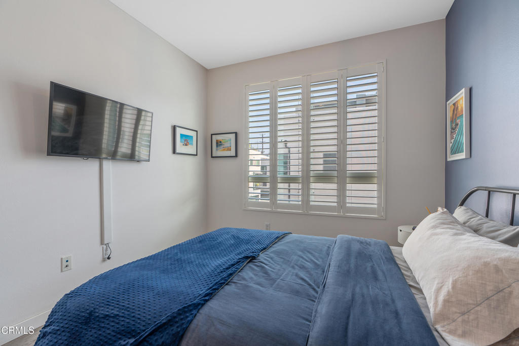 1553 Verbena Way Los Angeles, CA 90041 - Photo 26 of 31 a bedroom with a bed a flat screen tv and window