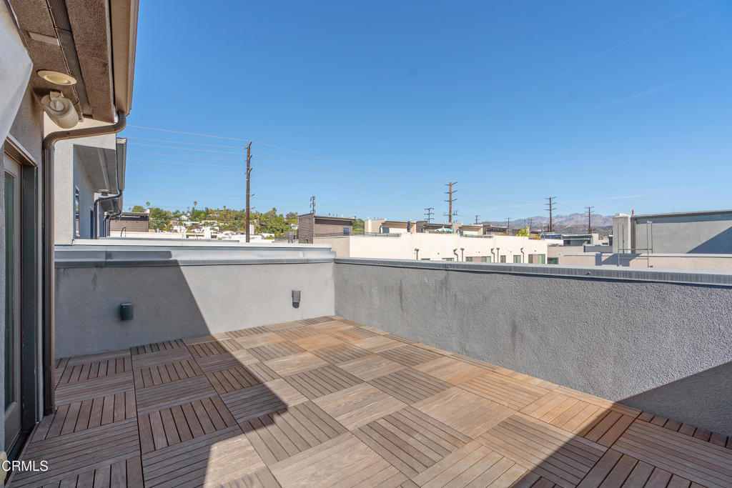 1553 Verbena Way Los Angeles, CA 90041 - Photo 30 of 31 a room with stainless steel appliances kitchen island granite countertop a sink and cabinets