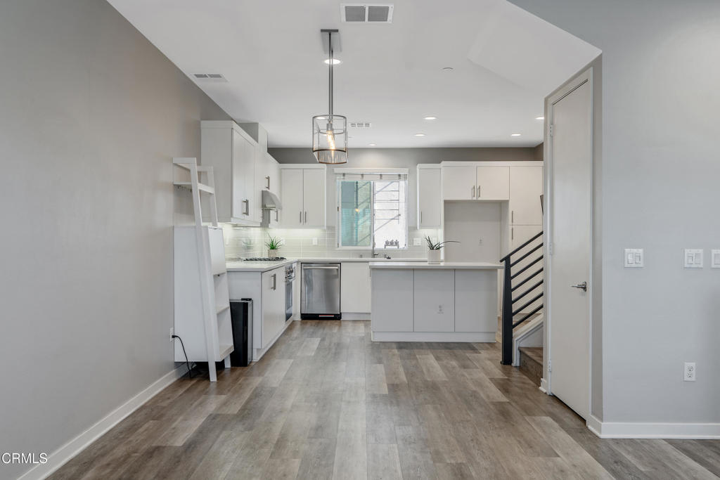 1553 Verbena Way Los Angeles, CA 90041 - Photo 6 of 31 a kitchen with white cabinets and appliances