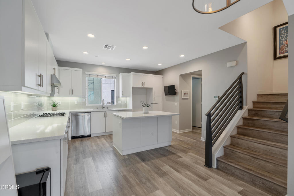 1553 Verbena Way Los Angeles, CA 90041 - Photo 8 of 31 a large kitchen with cabinets wooden floor and stainless steel appliances