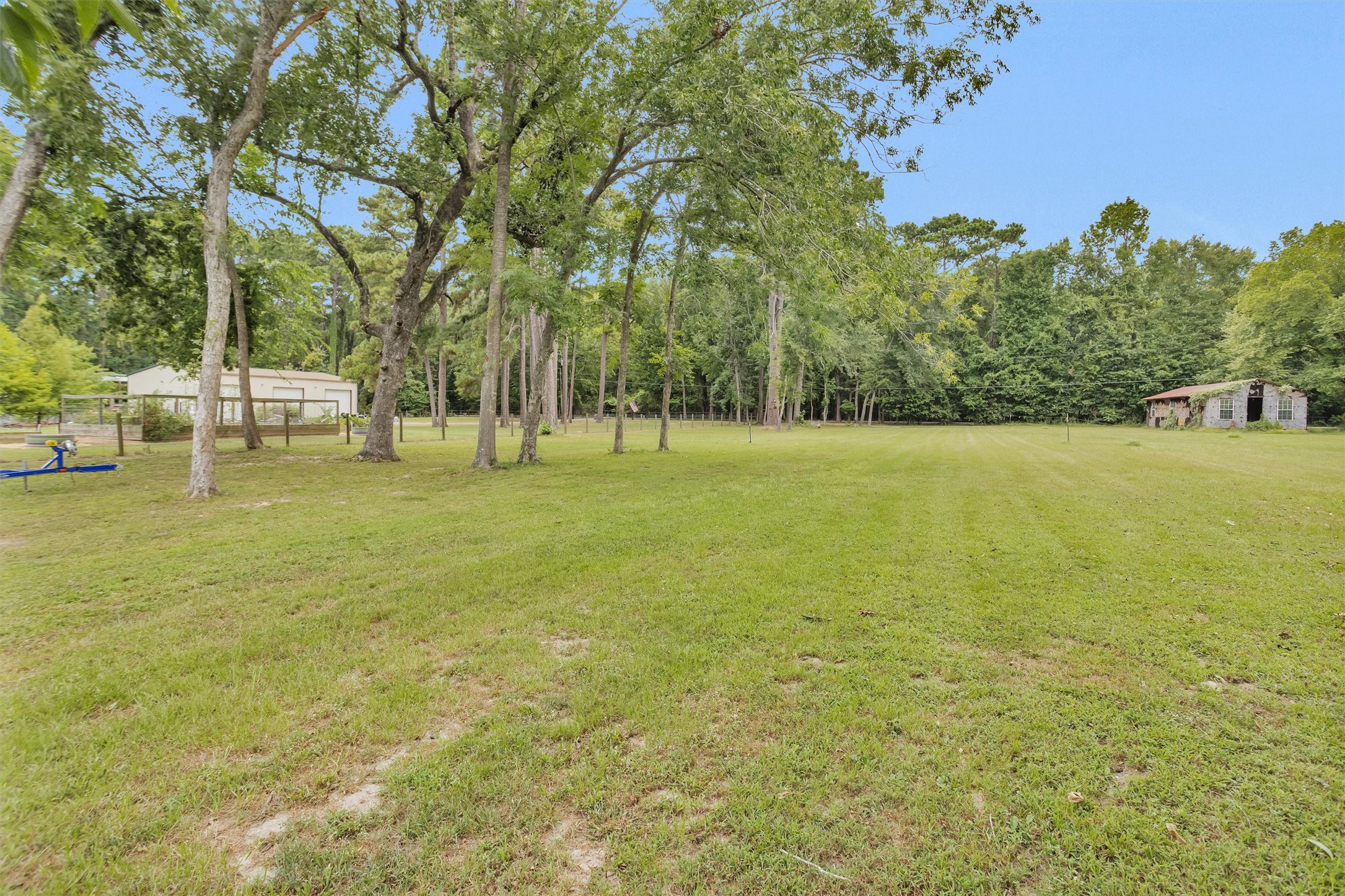 Gorgeous lush green lot with mature trees and ample open space, perfect for outdoor activities and your future vacation retreat.