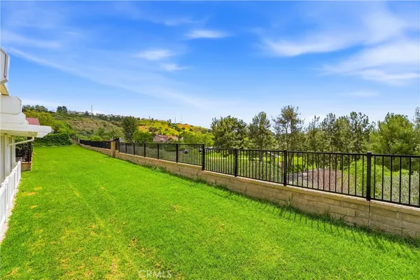 a view of a garden with a lake view