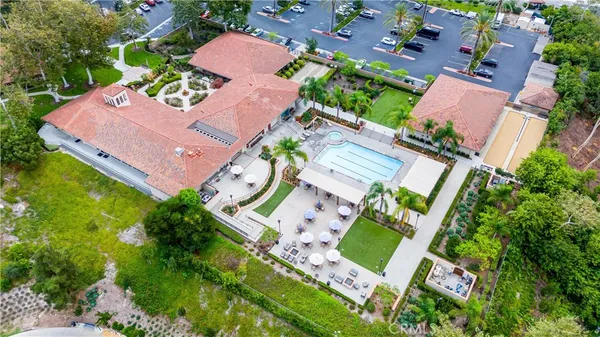 an aerial view of a houses with yard