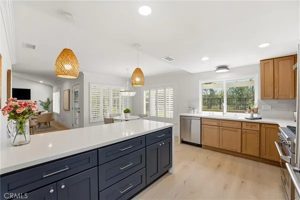 a kitchen with a sink and a large window