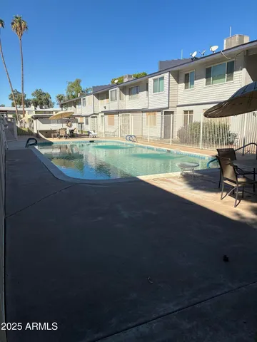 a view of pool with outdoor seating