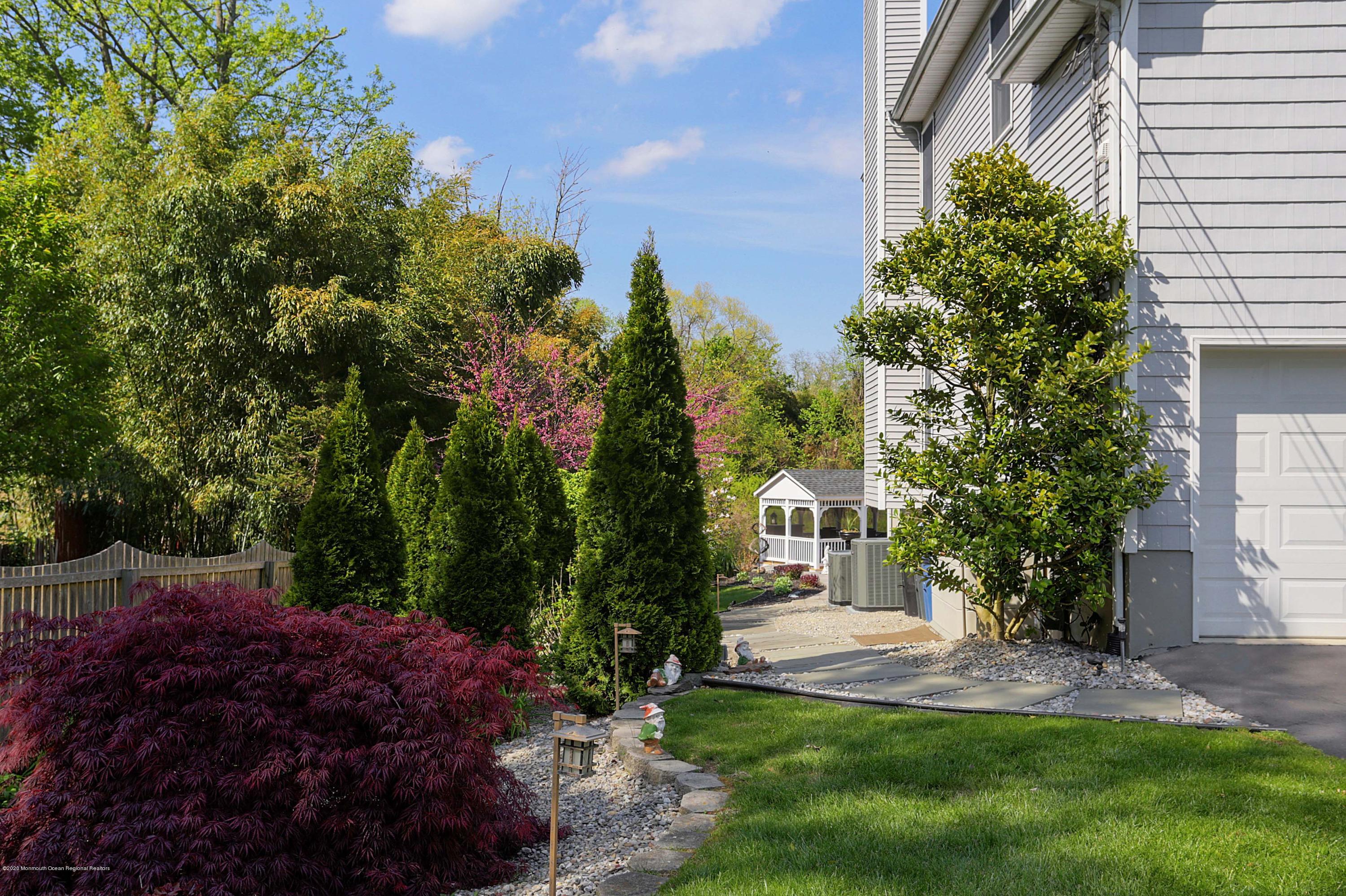 653 Locust Point Road Atlantic Highlands, NJ 07716 - Photo 4 of 57 side yard maple tree