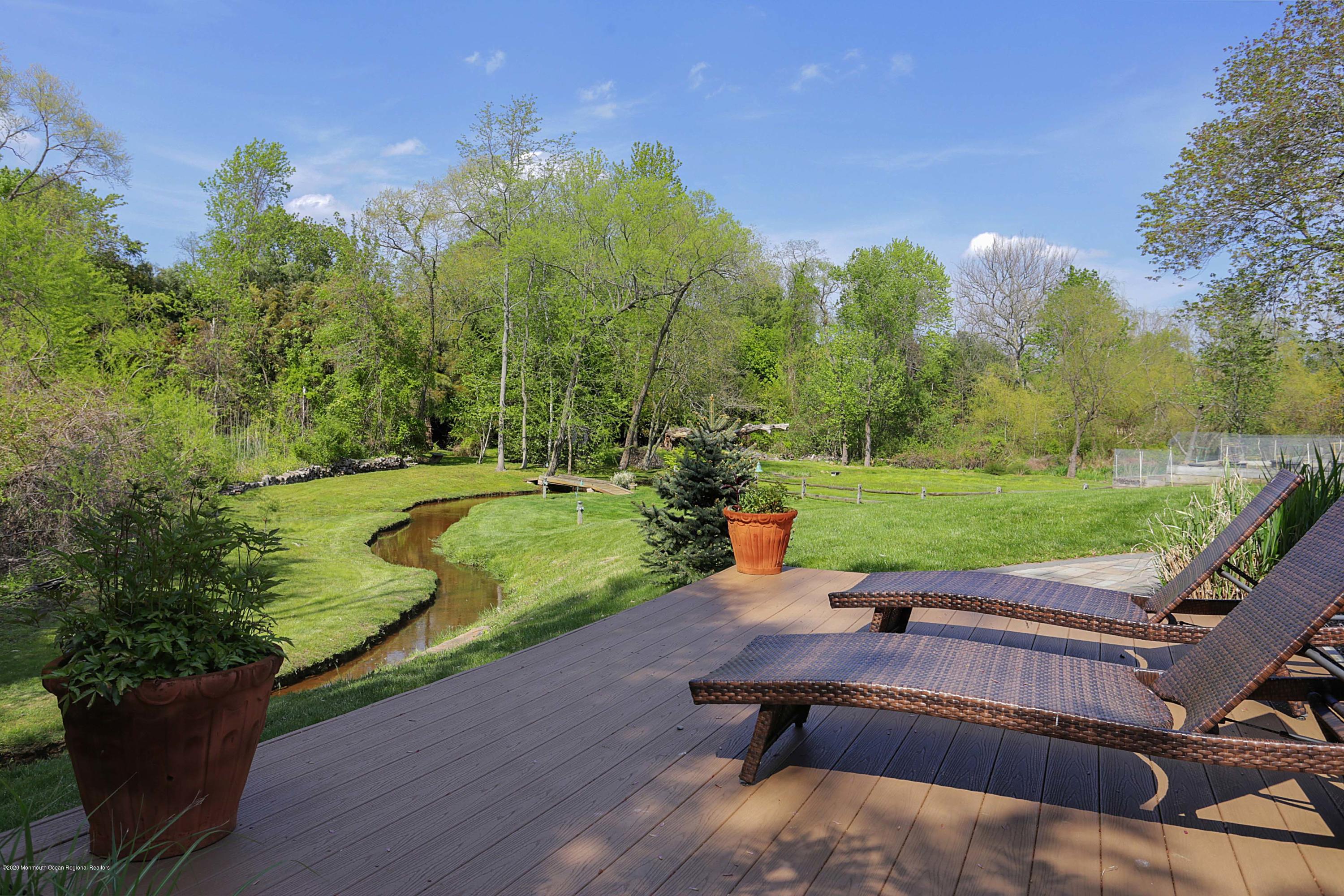 653 Locust Point Road Atlantic Highlands, NJ 07716 - Photo 5 of 57 trex deck view of brook