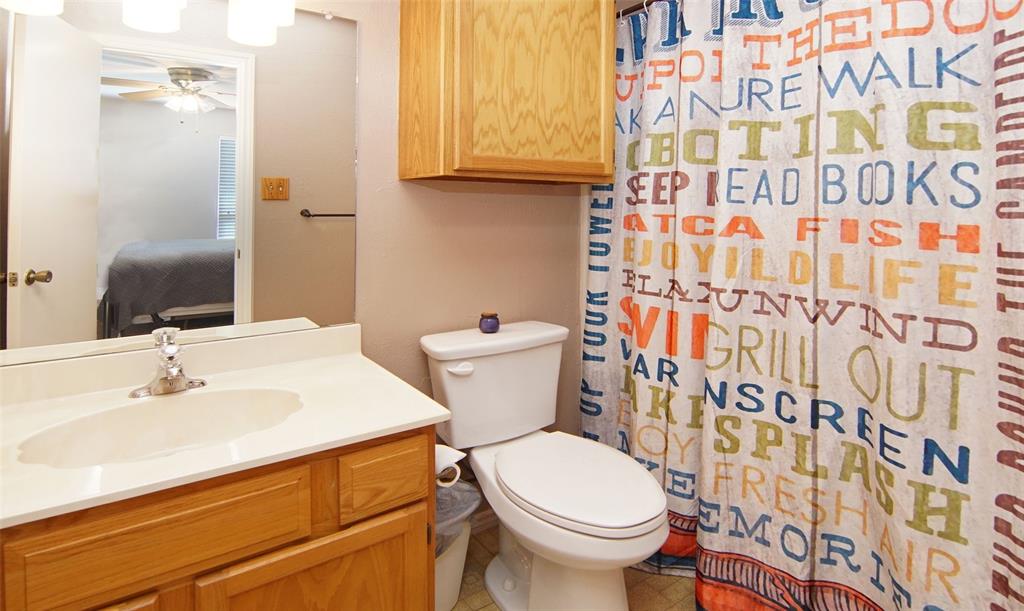 3109 Hells Gate Loop, Unit 59 Strawn, TX 76475 - Photo 16 of 25 a bathroom with a sink and a toilet