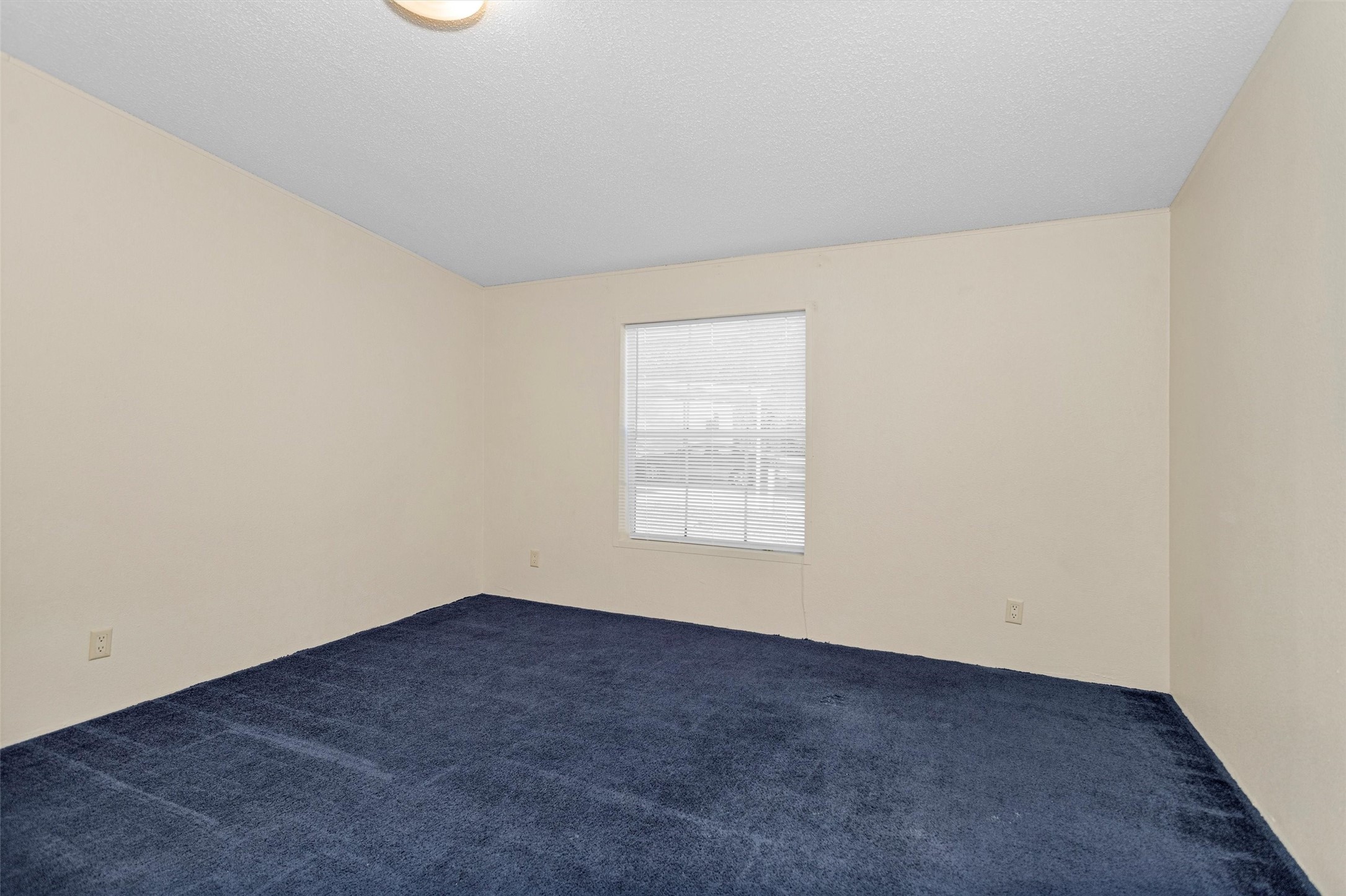 11261 Rose Road Conroe, TX 77303 - Photo 22 of 30 an empty room with a window