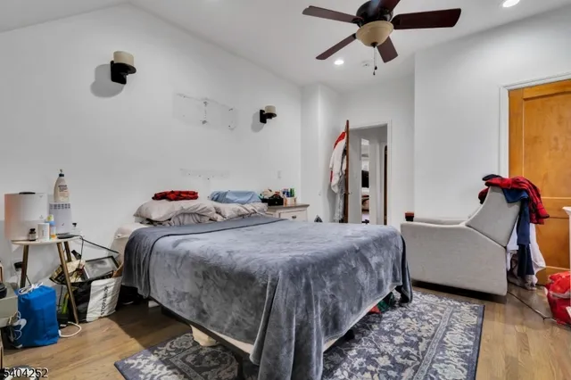 a bedroom with bed and a closet