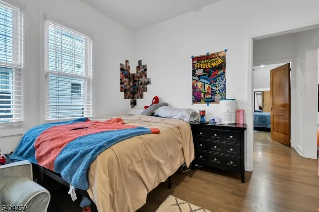 a kitchen with refrigerator and cabinets
