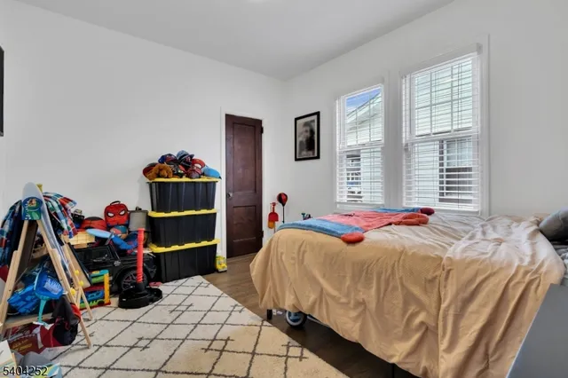 a living room with furniture and a christmas tree