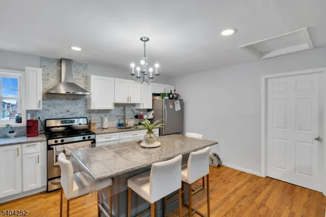 a bedroom with a bed a table and chair