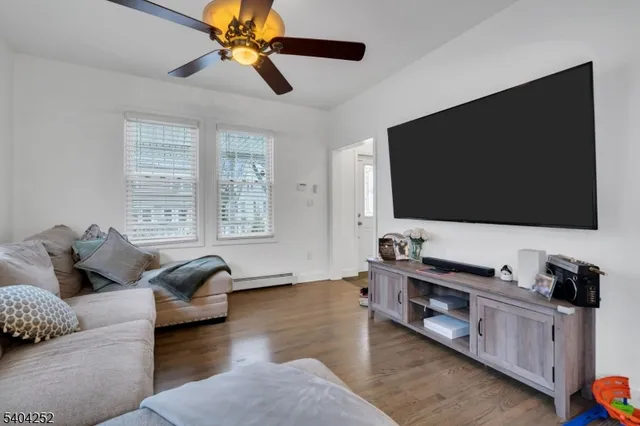 a kitchen with stainless steel appliances granite countertop a refrigerator a stove a sink and dishwasher