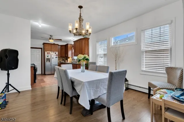 a kitchen with stainless steel appliances granite countertop a refrigerator a sink a stove a washer and dishwasher