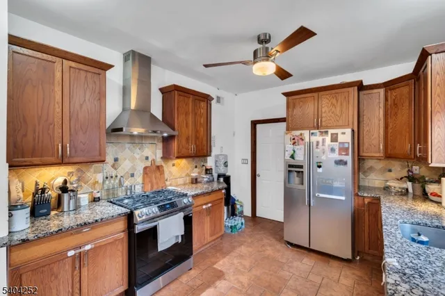 a bedroom with bed and a chandelier