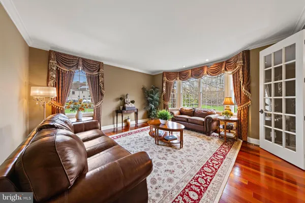 a open kitchen with stainless steel appliances granite countertop a stove oven and a dining table with wooden floor