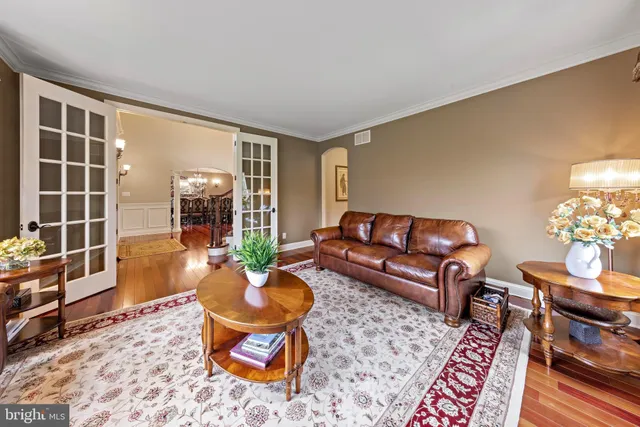 a bathroom with a granite countertop sink and a window