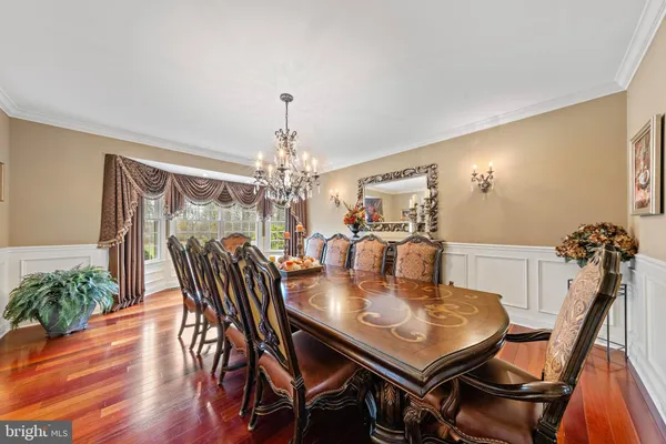 a kitchen with stainless steel appliances granite countertop a stove and a refrigerator