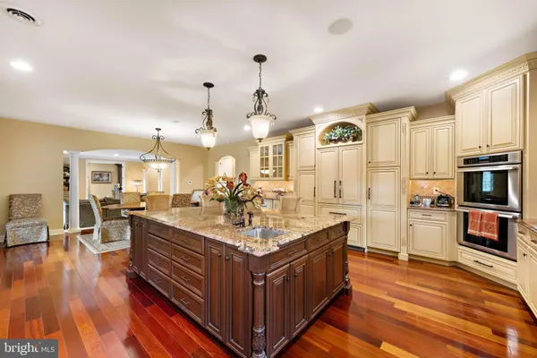 a living room with furniture a large window and a flat screen tv