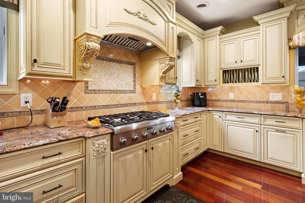 a view of fireplace with furniture and a fireplace