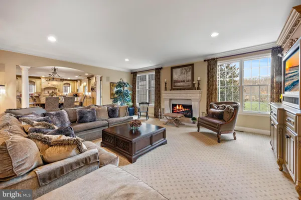 a bed sitting in a spacious bedroom next to a window