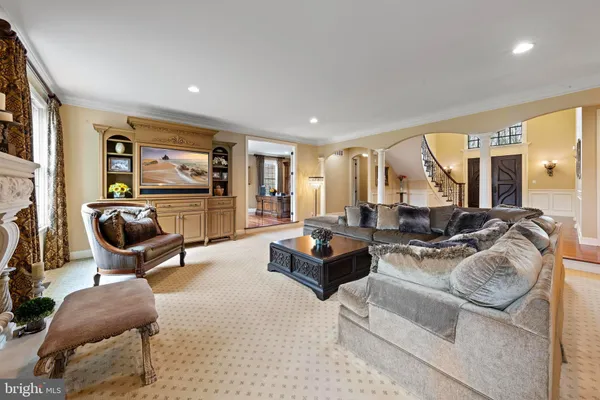 a spacious bedroom with a bed and glass window