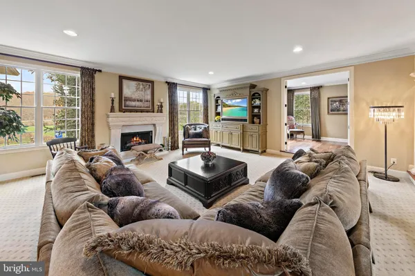 a living room with couch and a flat screen tv
