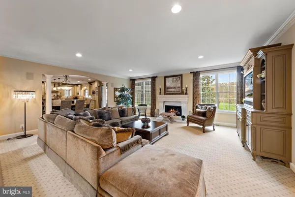 a bathroom with a granite countertop sink a toilet and a mirror