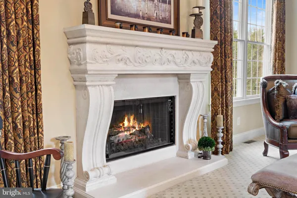 a living room with furniture gym equipment and a window