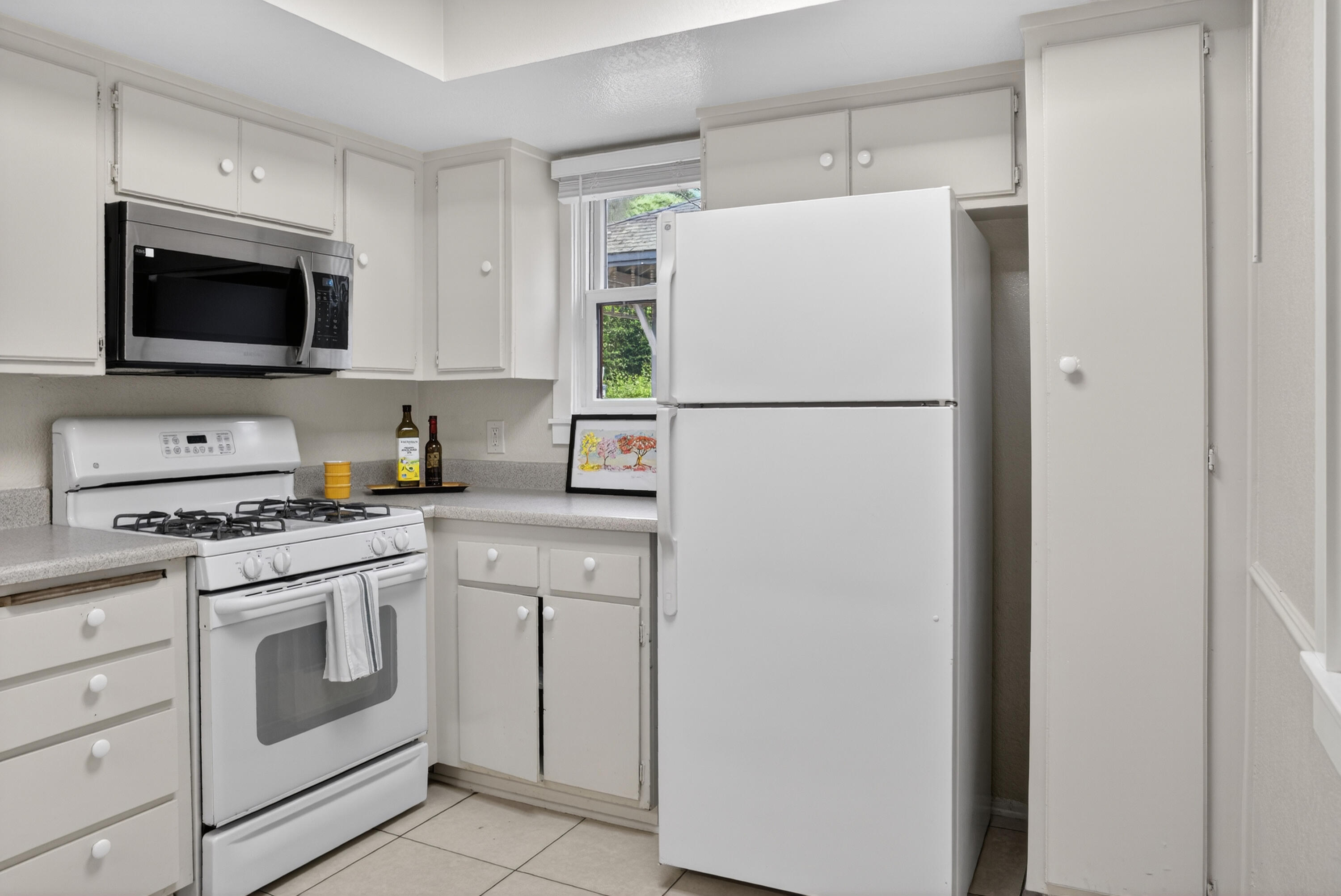 521 West Montecito Street, Unit 1 Santa Barbara, CA 93101 - Photo 13 of 36 a white refrigerator freezer sitting in a kitchen