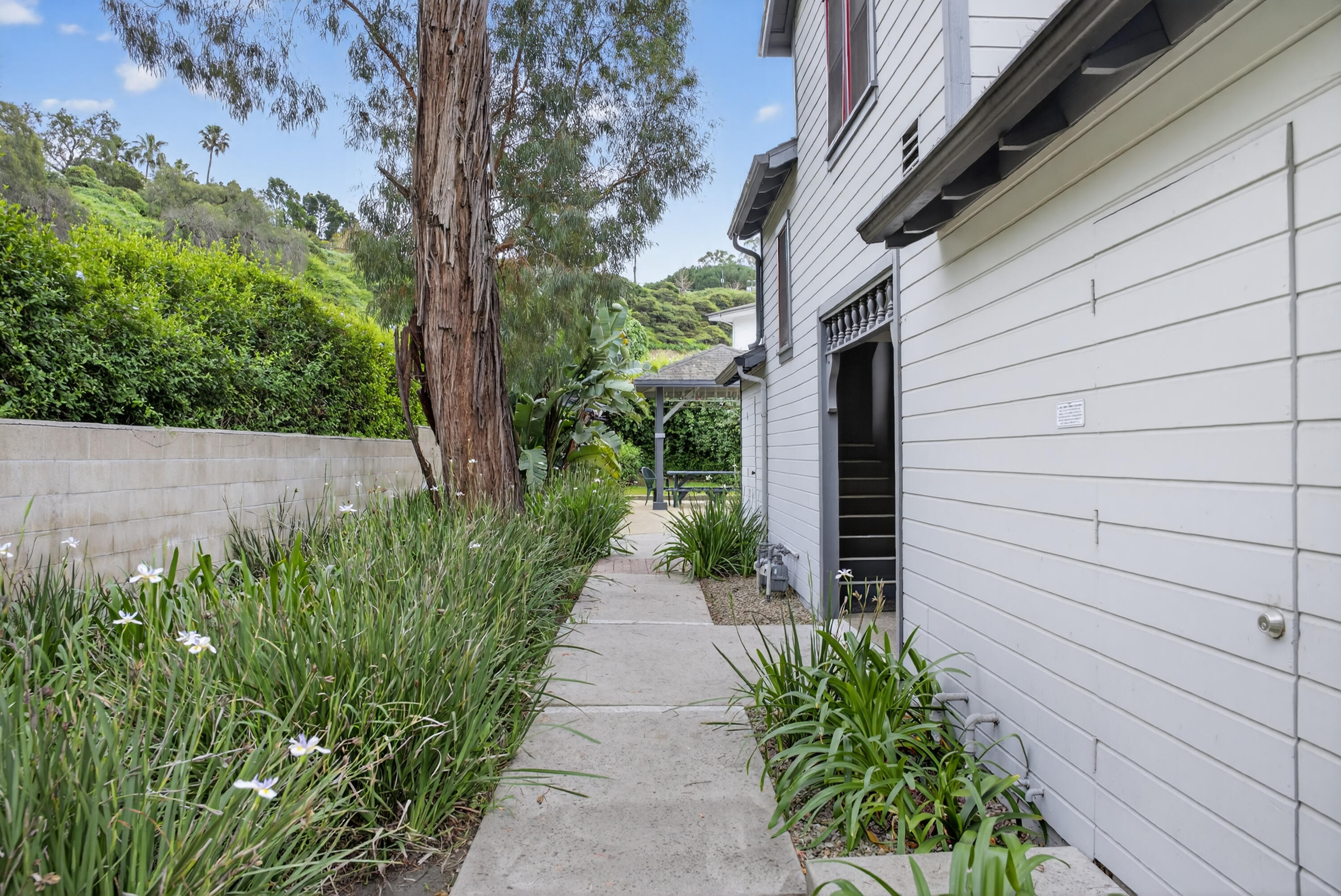 521 West Montecito Street, Unit 1 Santa Barbara, CA 93101 - Photo 14 of 36 a view of a pathway with a flower garden
