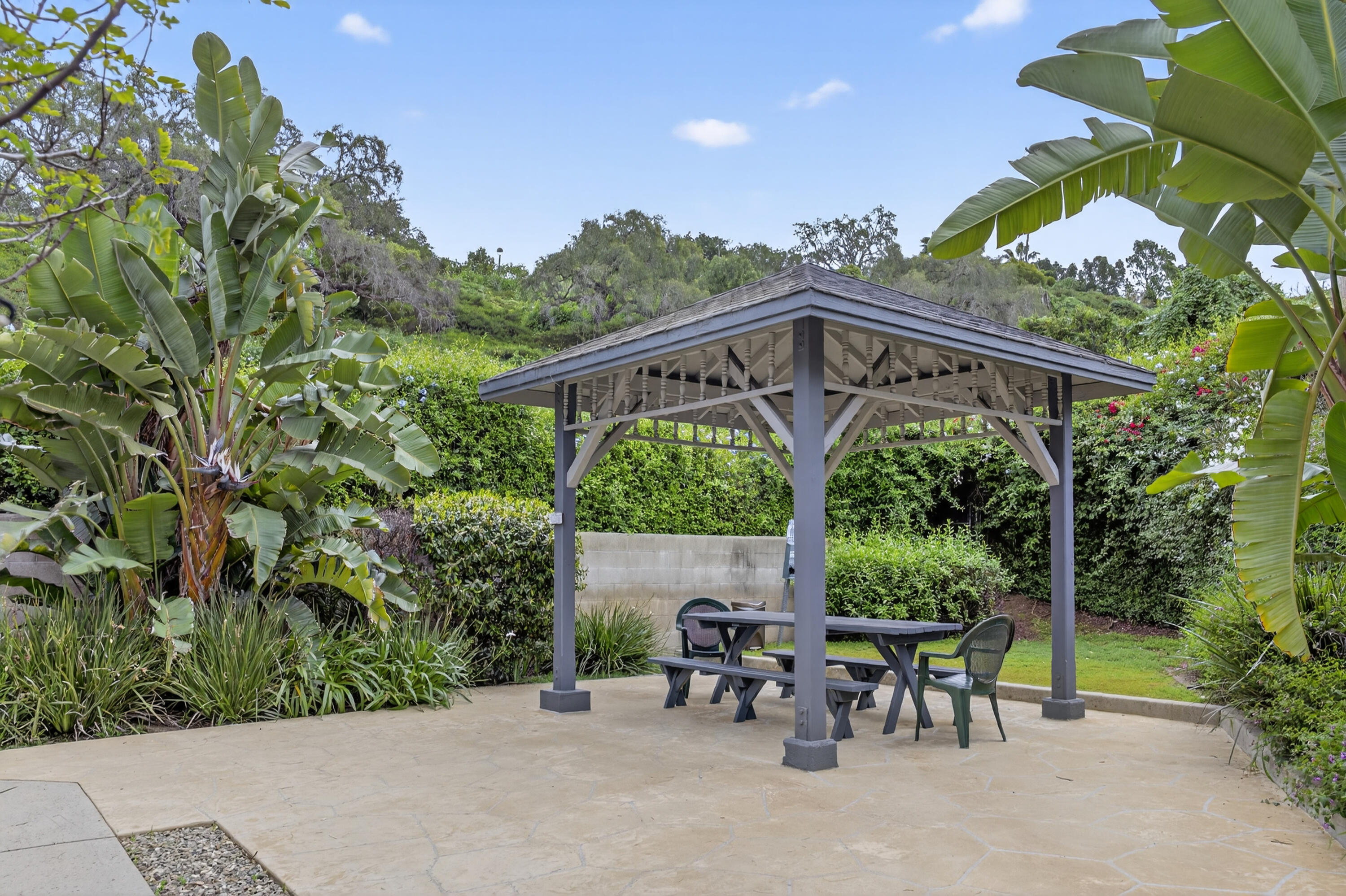 521 West Montecito Street, Unit 1 Santa Barbara, CA 93101 - Photo 27 of 36 a view of a patio with table and chairs and potted plants