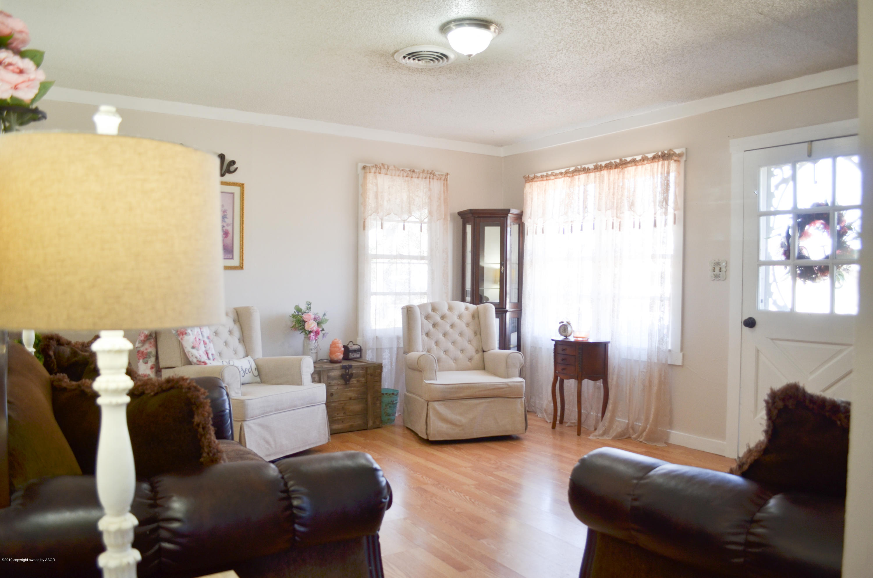 501 Southwest 45th Avenue Amarillo, TX 79110 - Photo 2 of 14 a living room with furniture and a large window