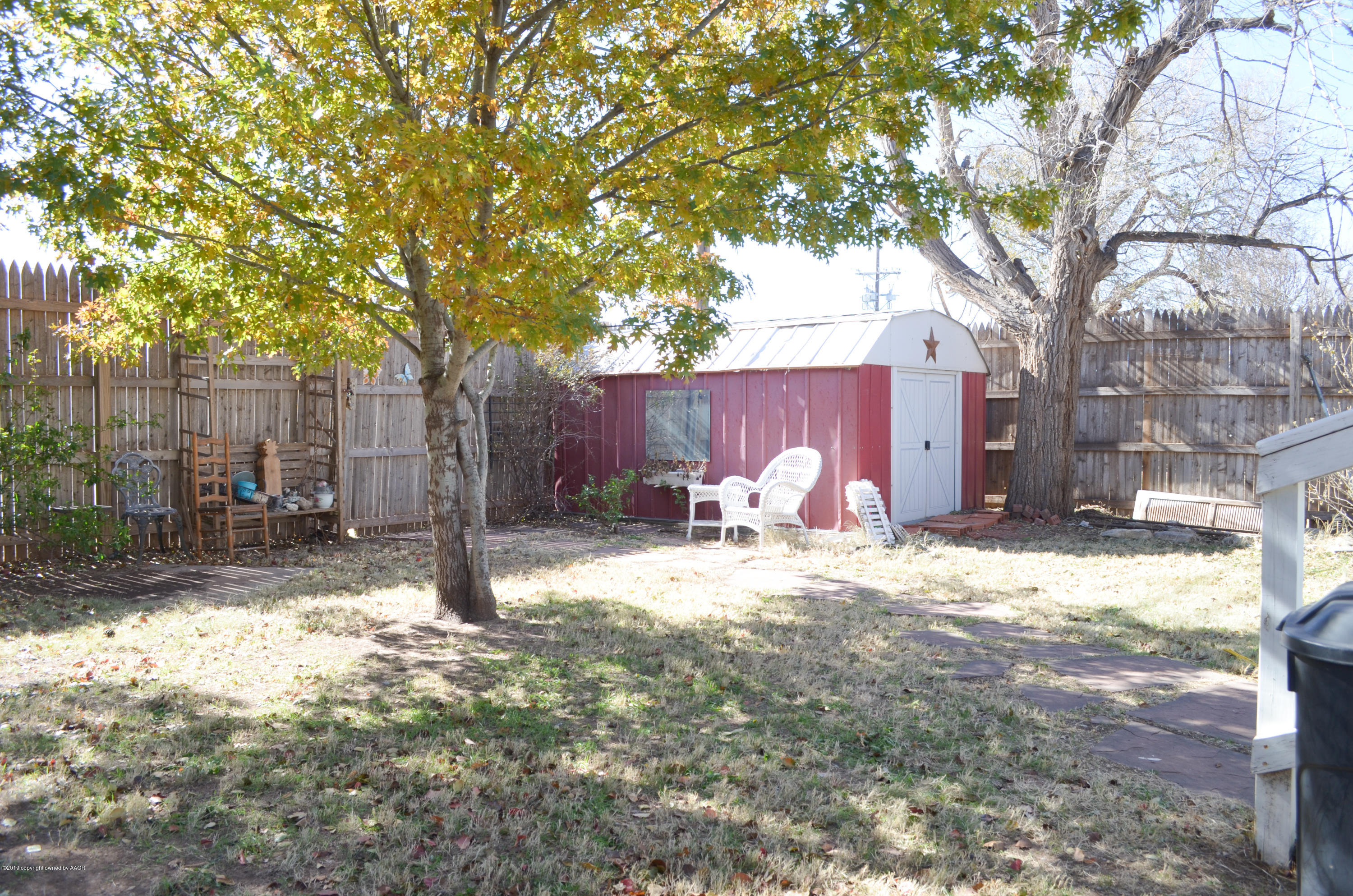 501 Southwest 45th Avenue Amarillo, TX 79110 - Photo 13 of 14 a backyard of a house with table and chairs