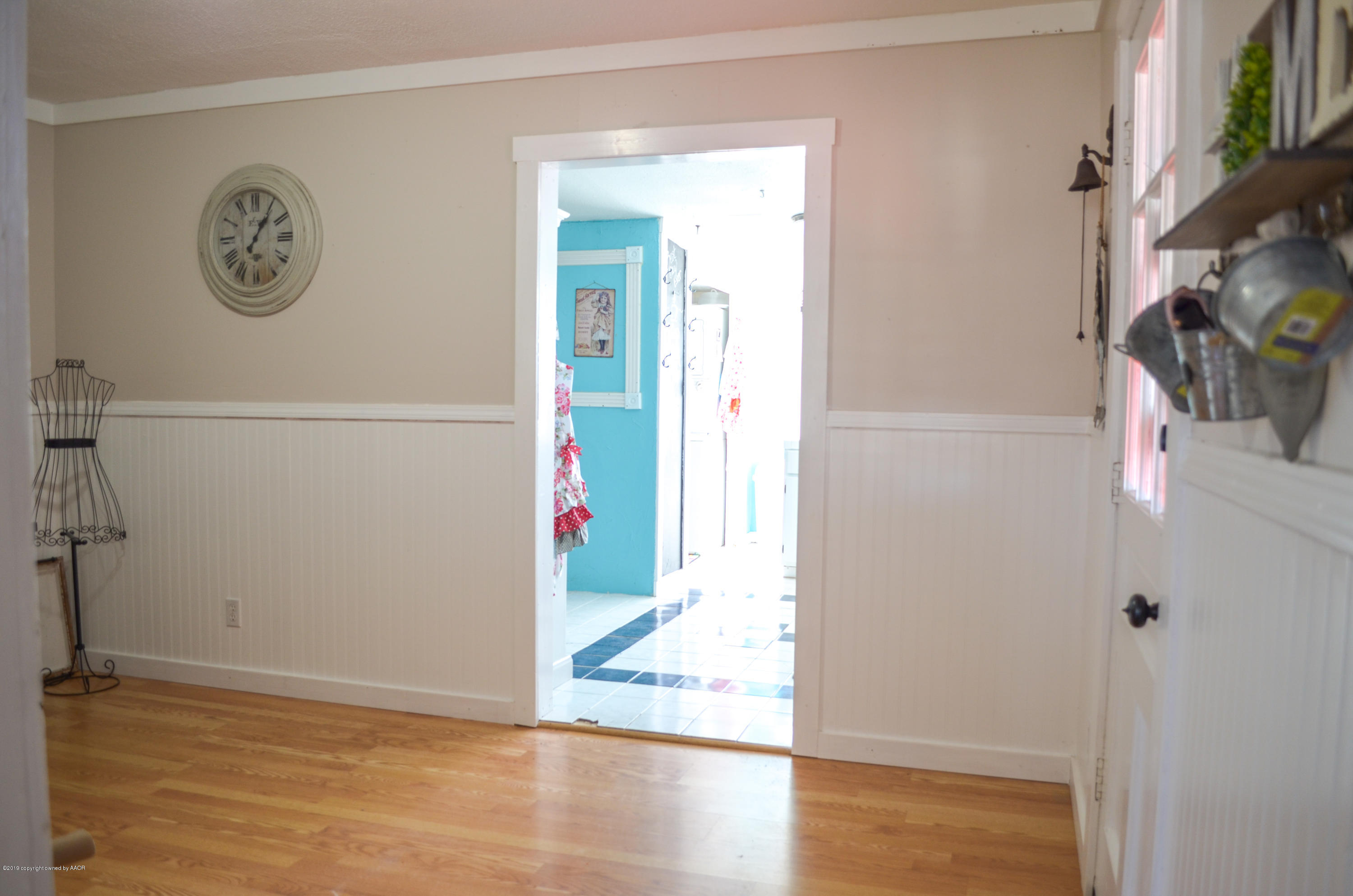 501 Southwest 45th Avenue Amarillo, TX 79110 - Photo 7 of 14 a view of a hallway with wooden floor