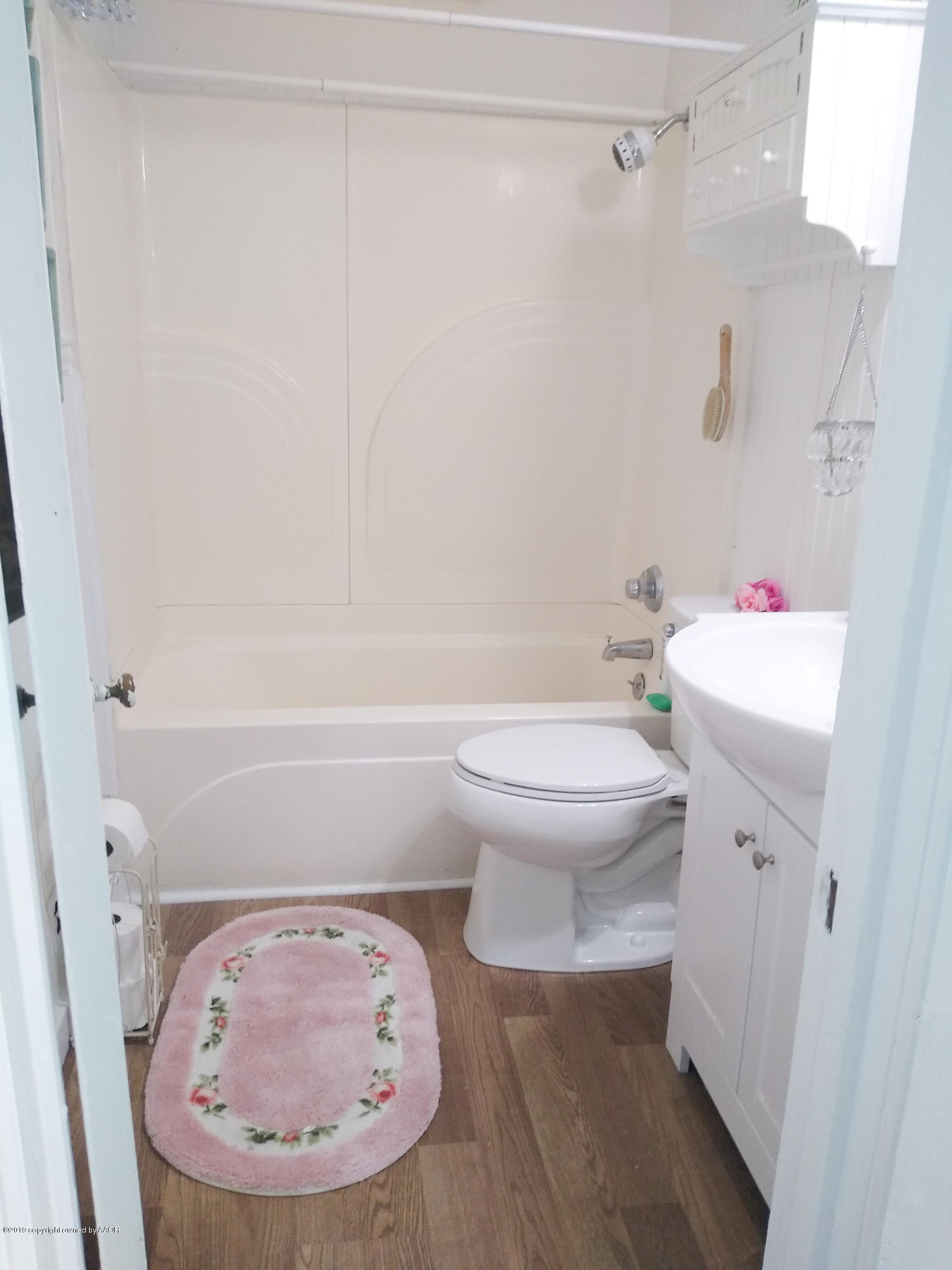 501 Southwest 45th Avenue Amarillo, TX 79110 - Photo 10 of 14 a bathroom with a toilet and a sink