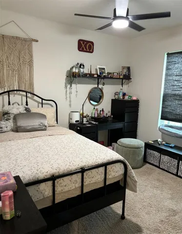 a bedroom with furniture and a bed