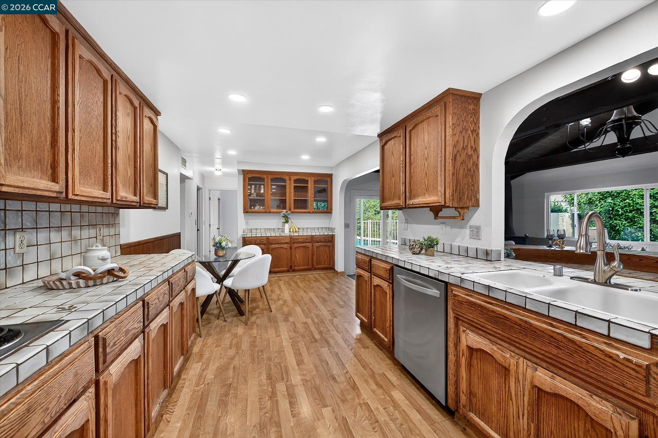 27 Milburn Court San Ramon, CA 94583 - Photo 17 of 41 a kitchen with a sink stove and cabinets