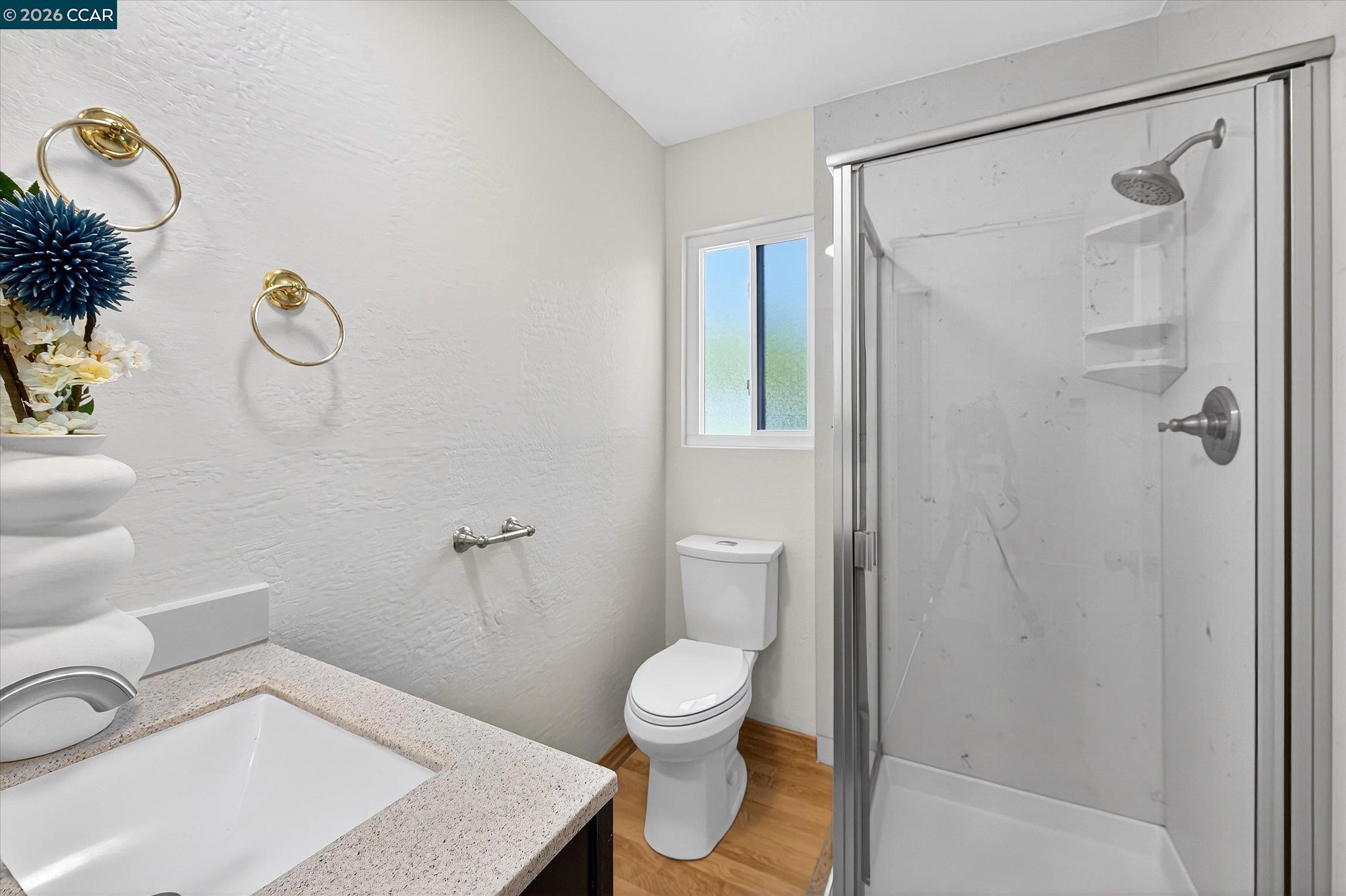 27 Milburn Court San Ramon, CA 94583 - Photo 23 of 41 a bathroom with a sink a toilet and shower