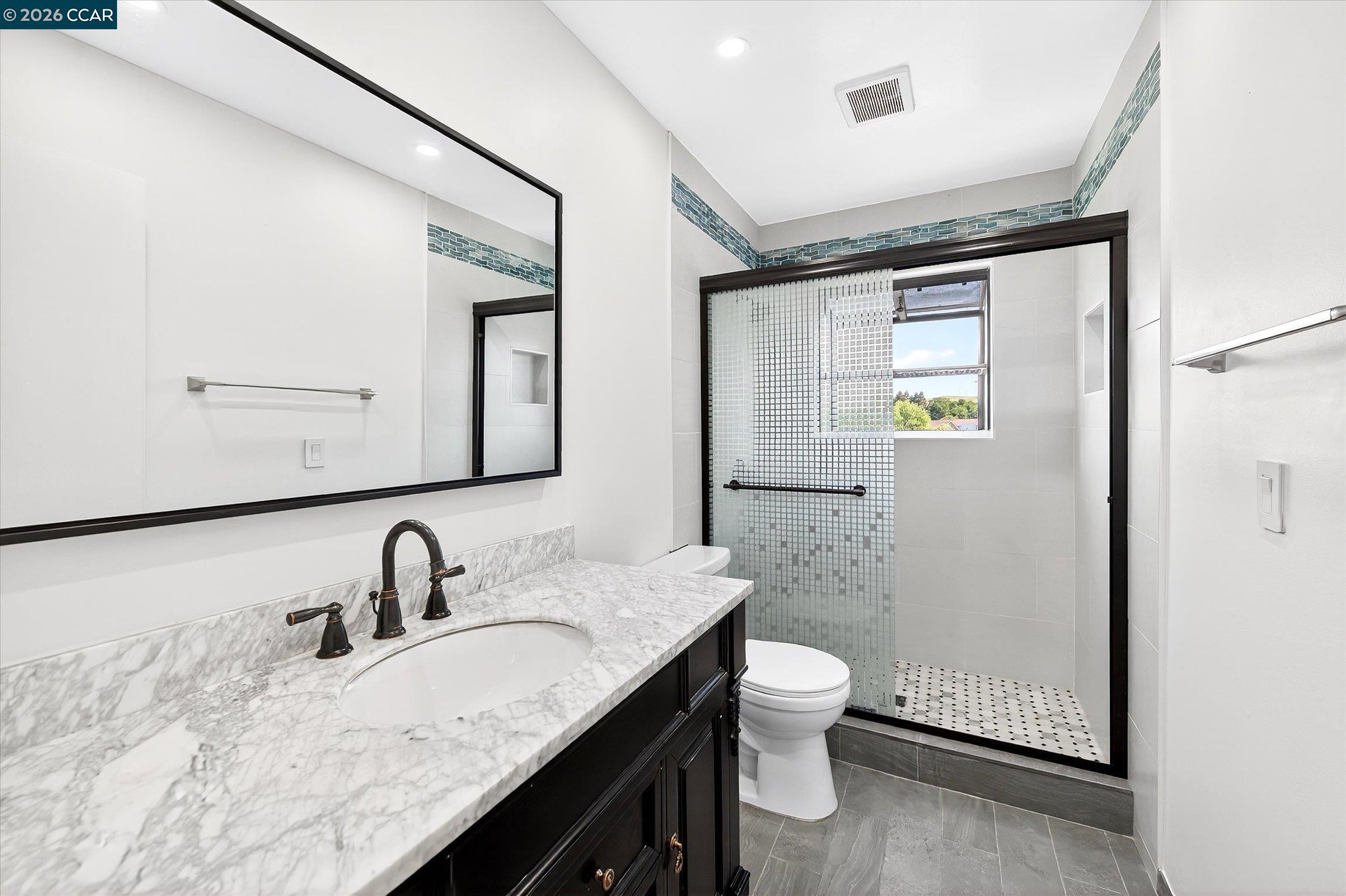 27 Milburn Court San Ramon, CA 94583 - Photo 24 of 41 a bathroom with a granite countertop sink toilet and shower