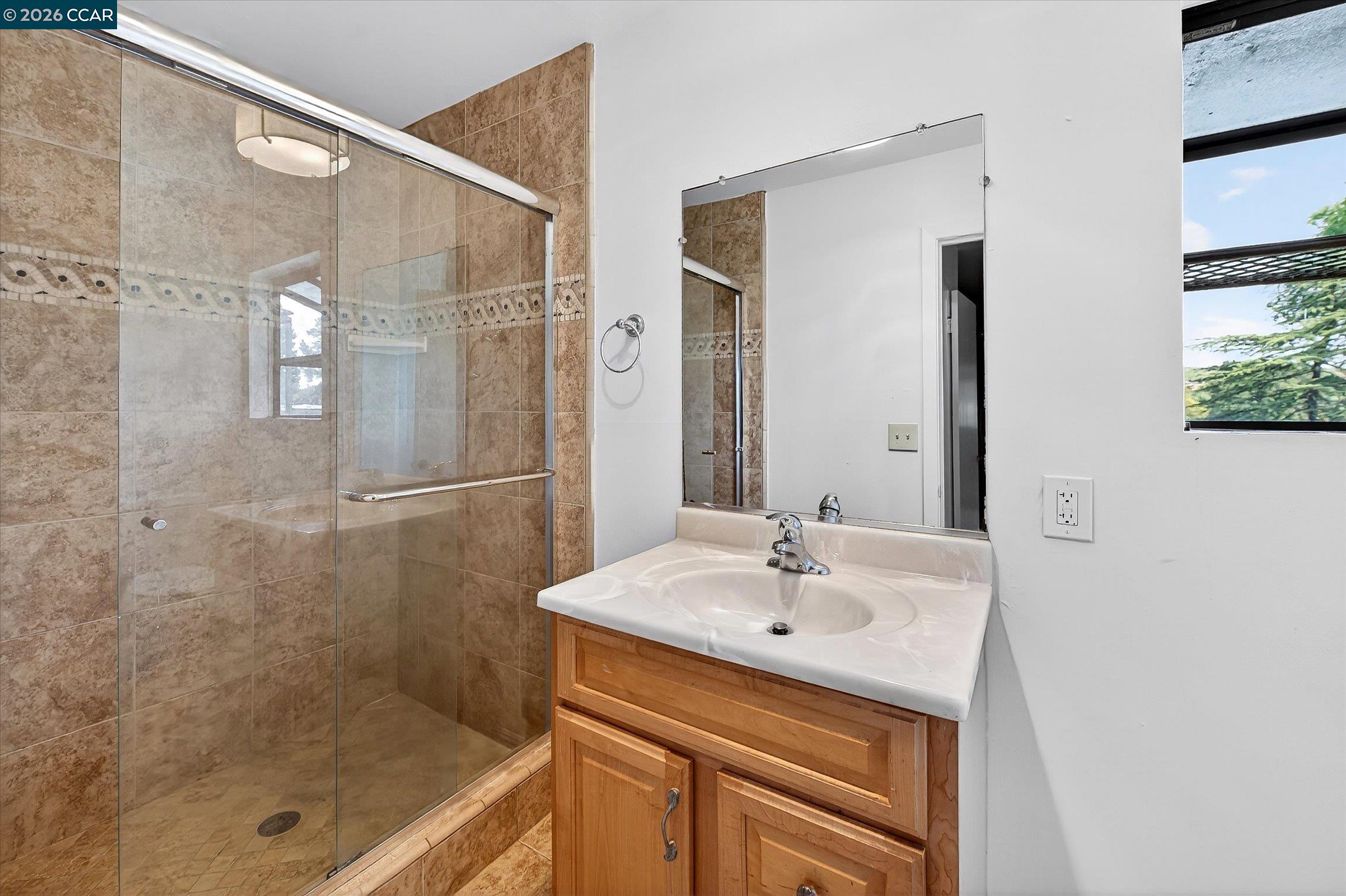27 Milburn Court San Ramon, CA 94583 - Photo 25 of 41 a bathroom with a shower sink and mirror