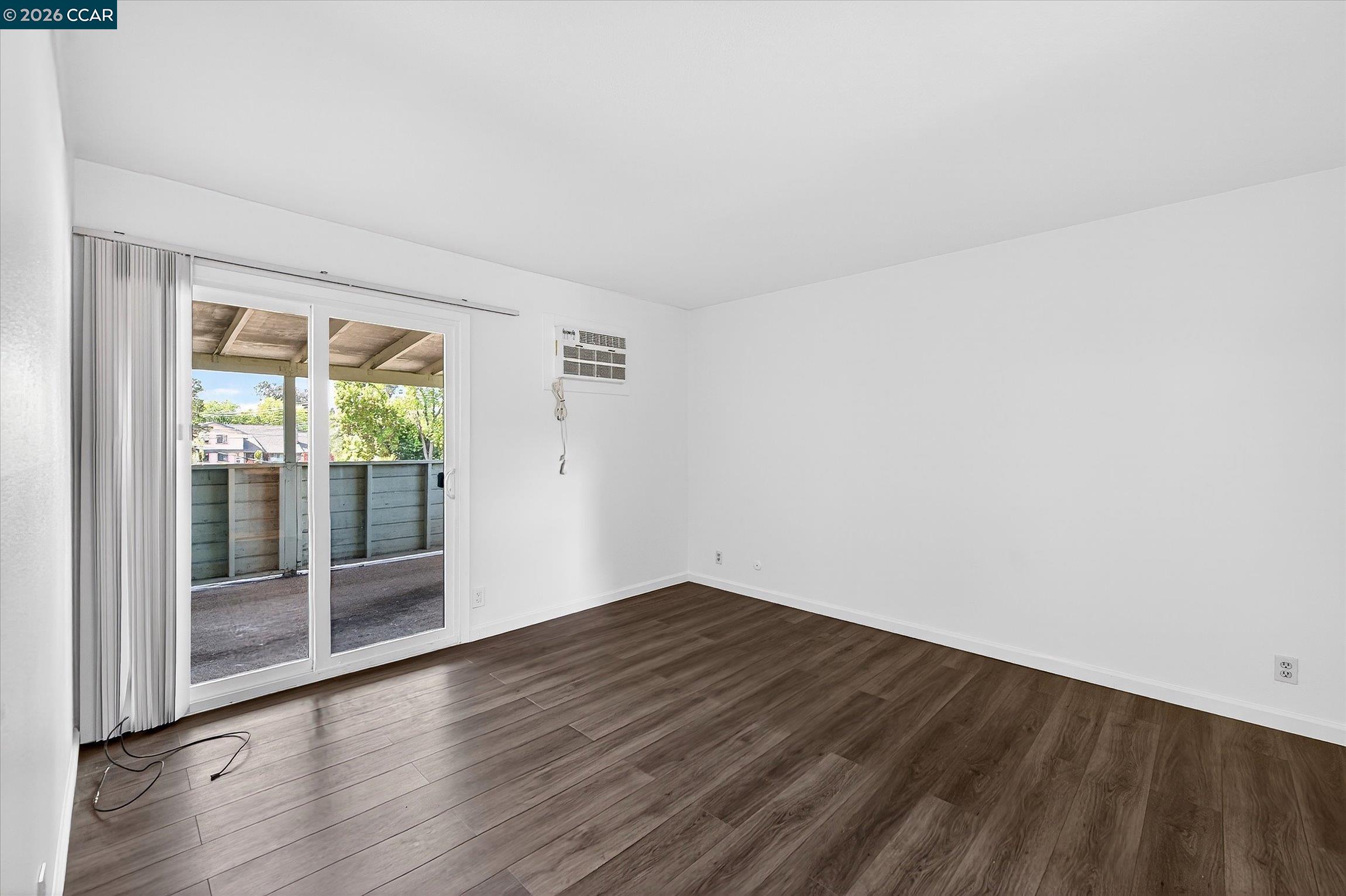 27 Milburn Court San Ramon, CA 94583 - Photo 27 of 41 an empty room with wooden floor and windows