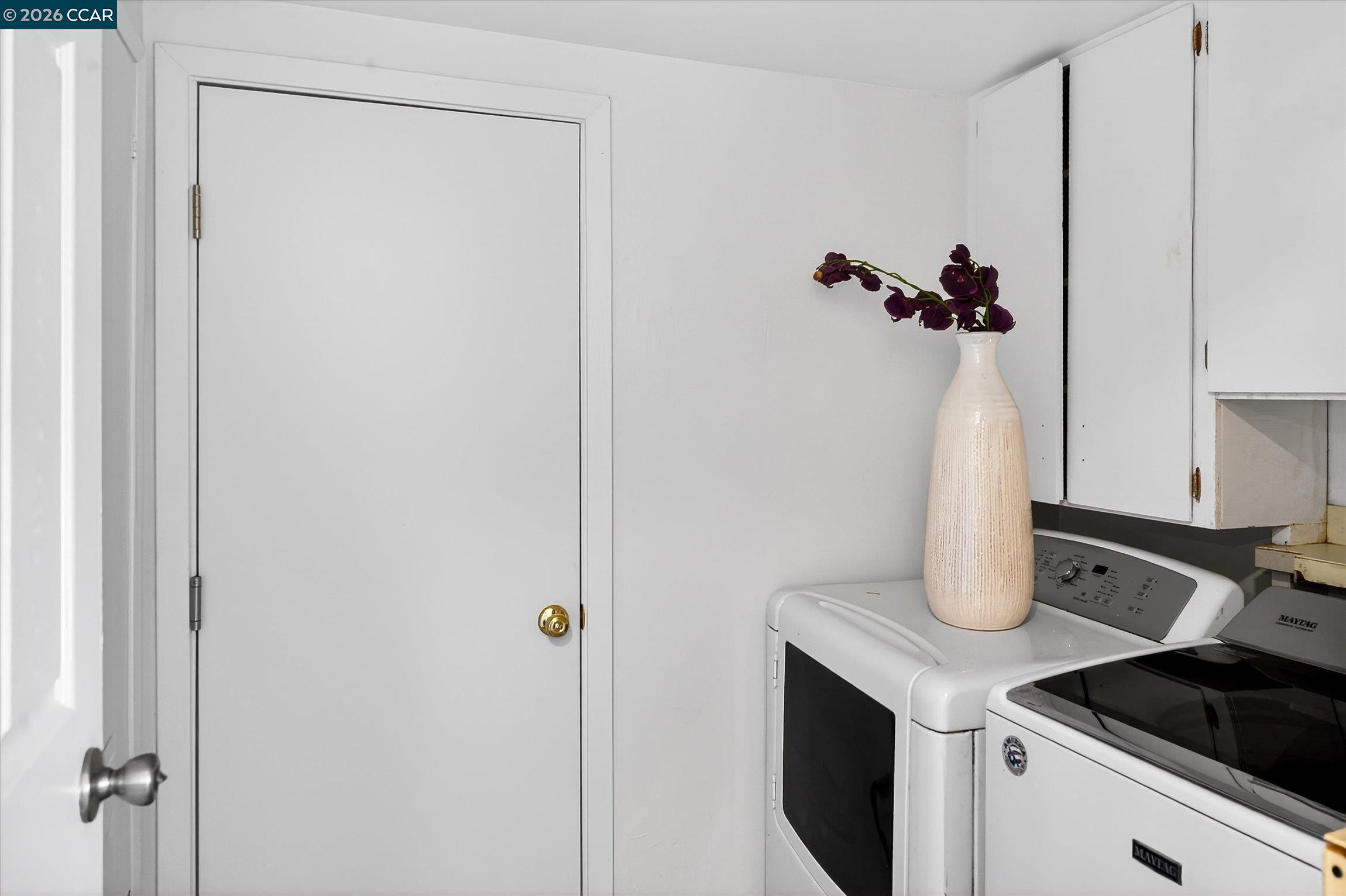 27 Milburn Court San Ramon, CA 94583 - Photo 30 of 41 a kitchen with a refrigerator and cabinets