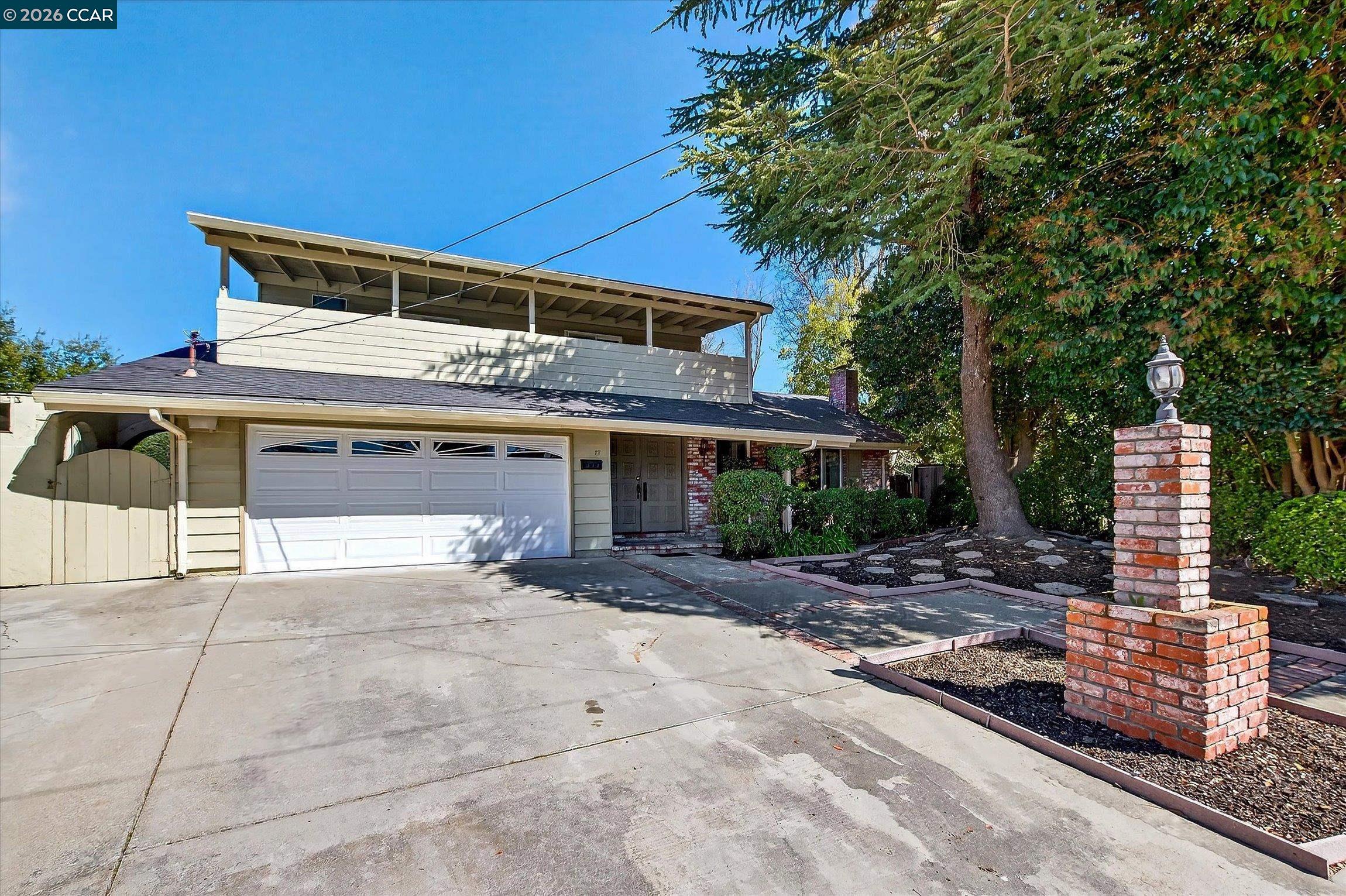 27 Milburn Court San Ramon, CA 94583 - Photo 3 of 41 a front view of a house with garden