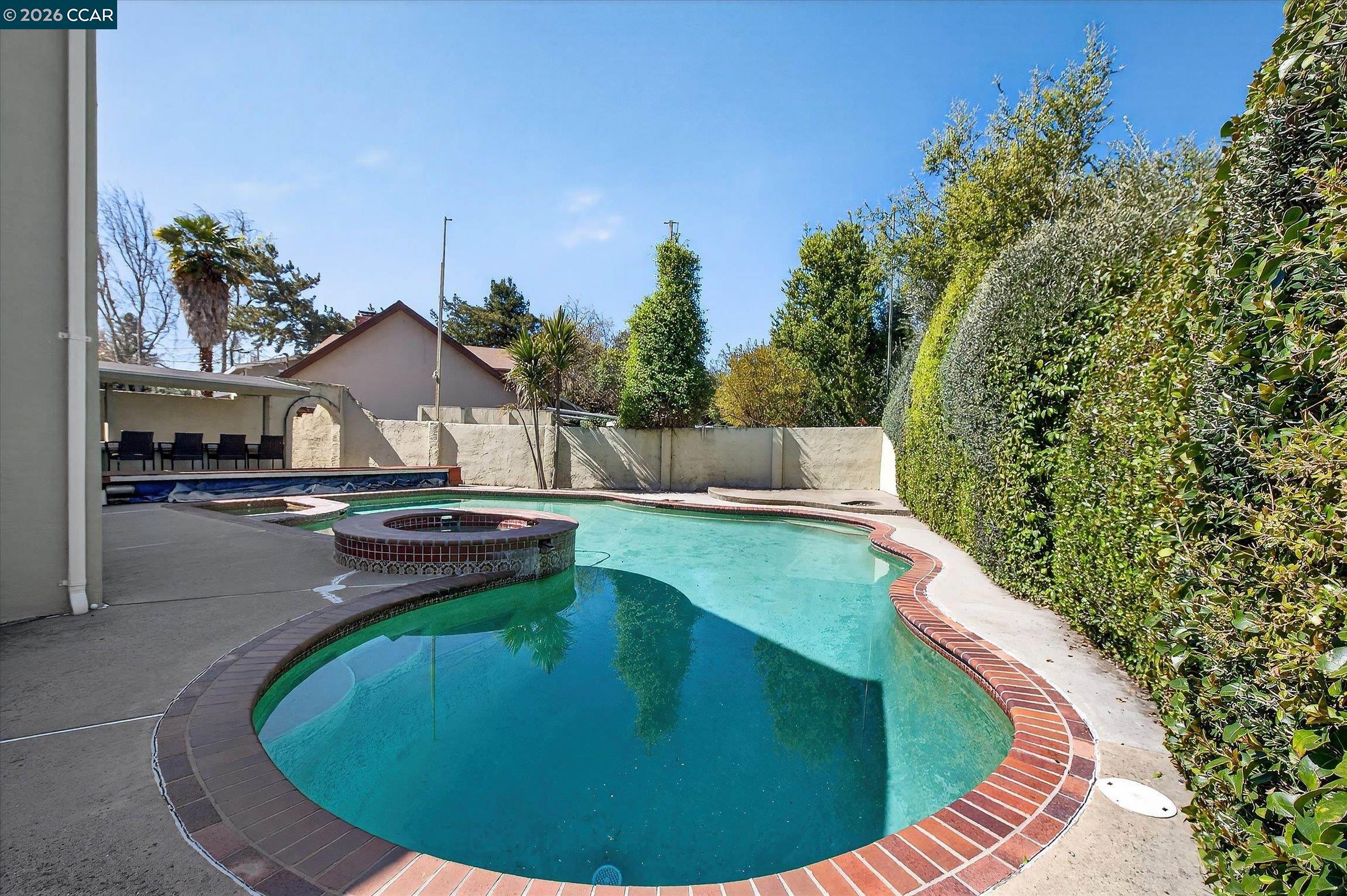 27 Milburn Court San Ramon, CA 94583 - Photo 32 of 41 a view of a swimming pool with a yard