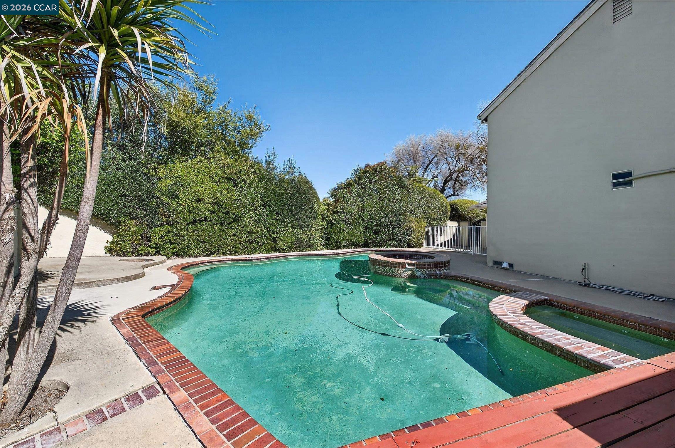 27 Milburn Court San Ramon, CA 94583 - Photo 35 of 41 a view of a swimming pool with a yard