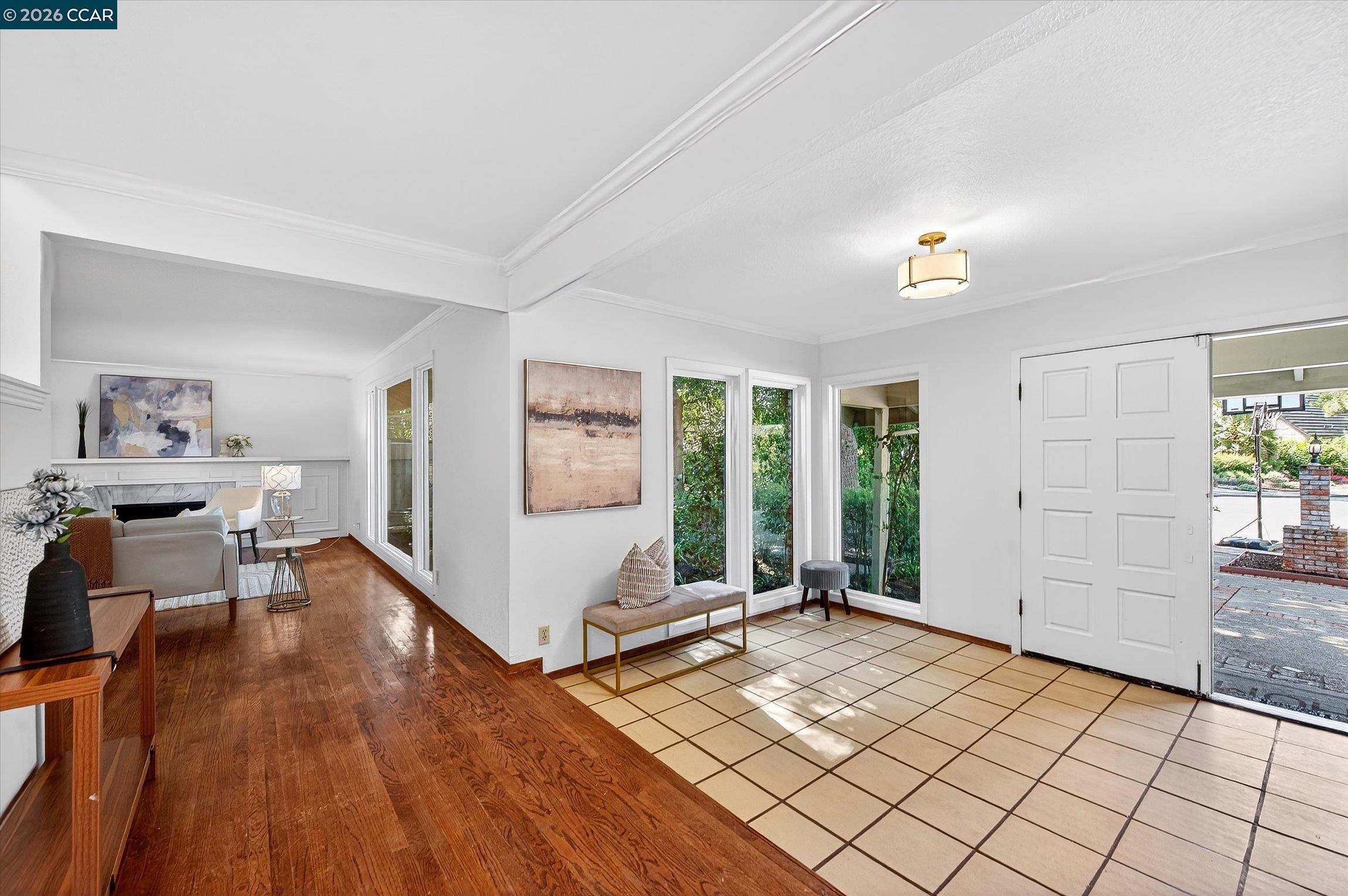 27 Milburn Court San Ramon, CA 94583 - Photo 4 of 41 a view of a livingroom with furniture hardwood and hallway