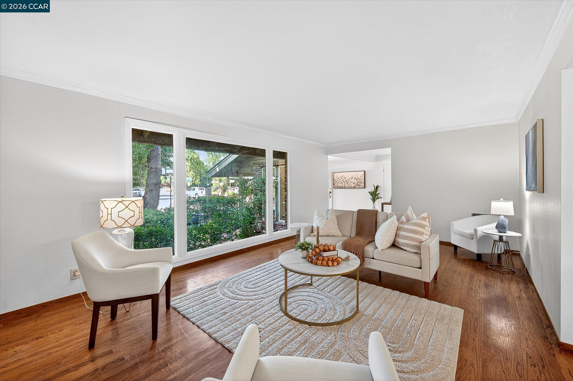 27 Milburn Court San Ramon, CA 94583 - Photo 9 of 41 a living room with furniture and a wooden floor